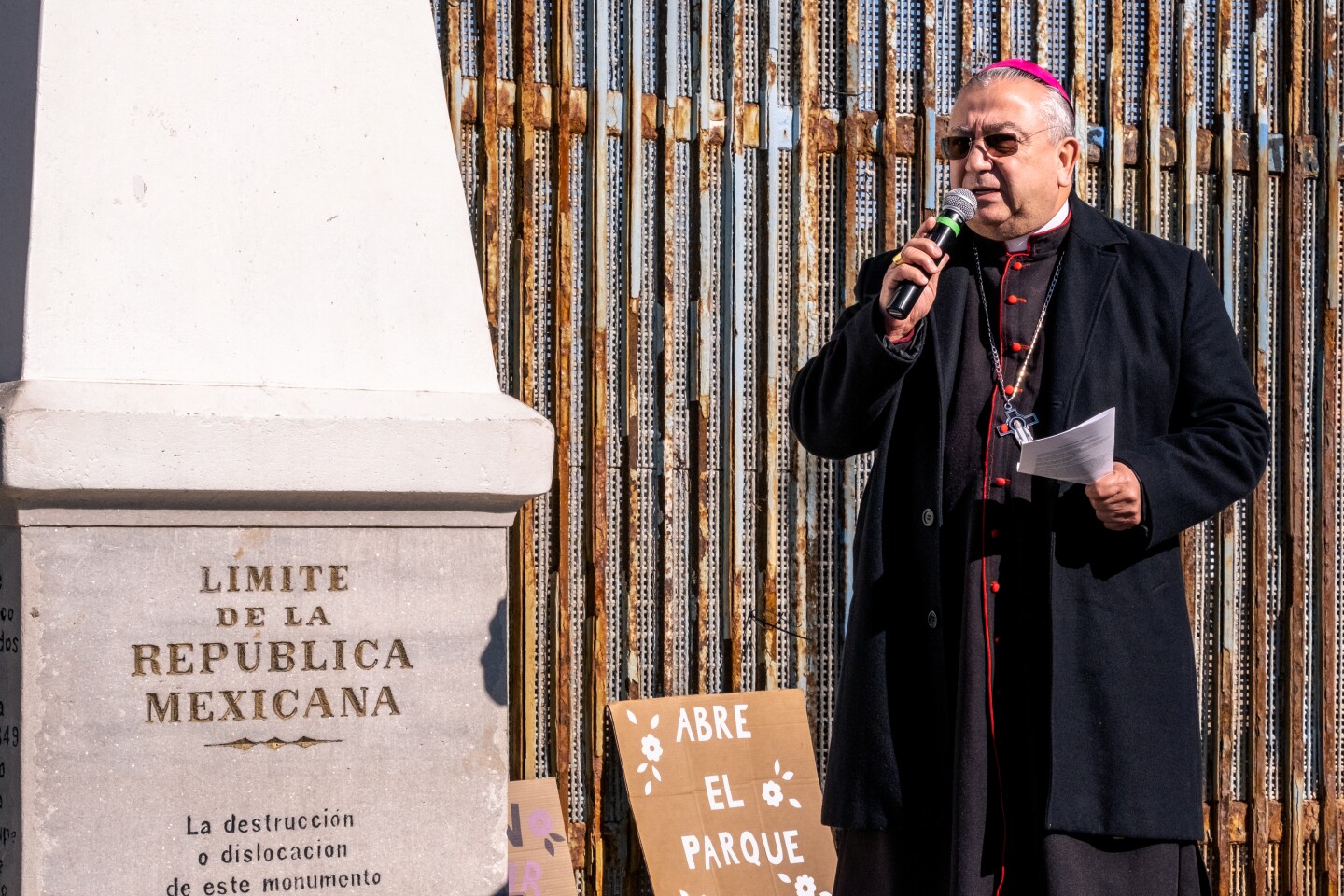 Archbishop of Tijuana Francisco Moreno Barrón stands in front of the border wall separating the United States and Mexico during the 29th annual La Posada Sin Fronteras or Without Borders. Tijuana, Dec. 10, 2022.