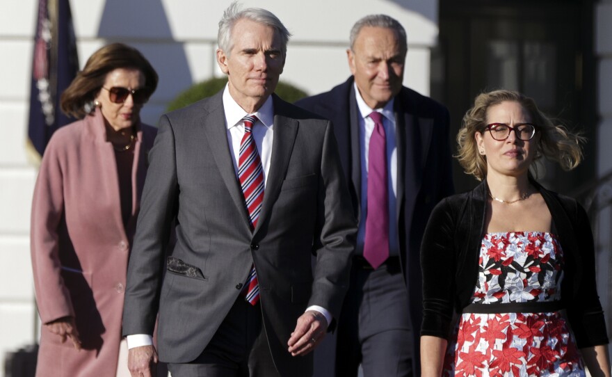 Sens. Rob Portman, R-Ohio, and Kyrsten Sinema, D-Ariz., front, led negotiations that resulted in the infrastructure bill.