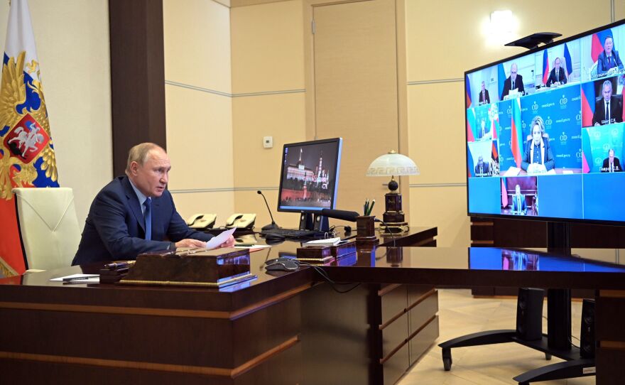 Russian President Vladimir Putin chairs a meeting with members of the Security Council via a video conference at the Novo-Ogaryovo state residence outside Moscow on Friday.