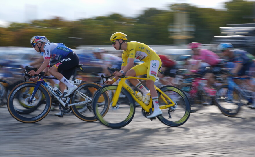 Slovenia's Tadej Pogacar, wearing the overall leader's yellow jersey, rides during the last stage of the Tour de France cycling race with start and finish in Paris, Sunday, July 26, 2026.