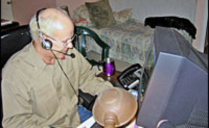 John Miller, an employee of call center company Willow CSN, works out of his bedroom in Poughkeepsie, N.Y.
