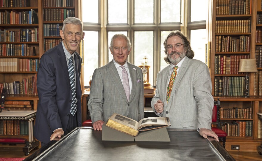 Jonathan Bate (former Provost of Worcester College Oxford), King Charles II, and Gregory Doran (Royal Shakespeare Company Artistic Director Emeritus) with King Charles I's First Folio.