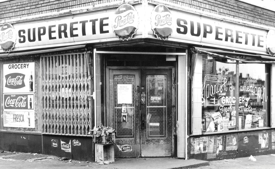 A storefront of a New York City bodega from the 1950s or '60s.