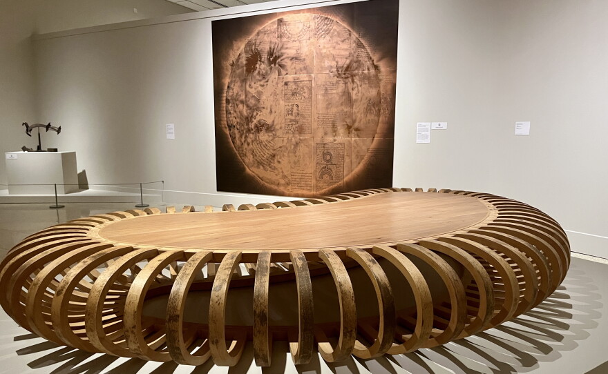 A wooden sculpture and metal art piece are displayed inside the San Diego Museum of Art, Sept. 2, 2026.