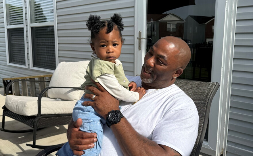 Anthony Bailey, 61, holds one of his grandchildren in this May 2025 photo.