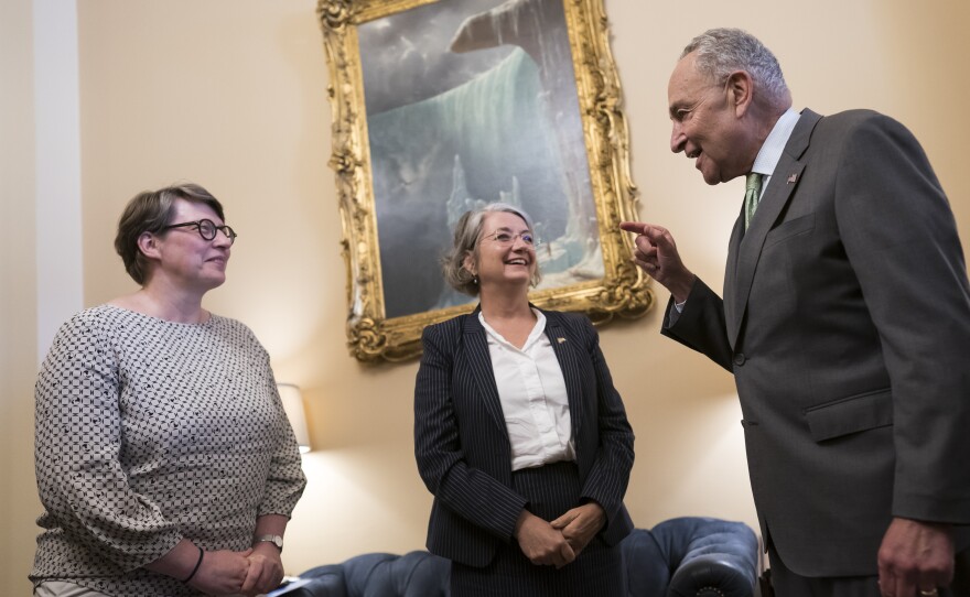 Senate Majority Leader Chuck Schumer, D-N.Y., right, welcomes Paivi Nevala, minister counselor of the Finnish Embassy, left, and Karin Olofsdotter, Sweden's ambassador to the U.S., on Wednesday, Aug. 3, 2022.