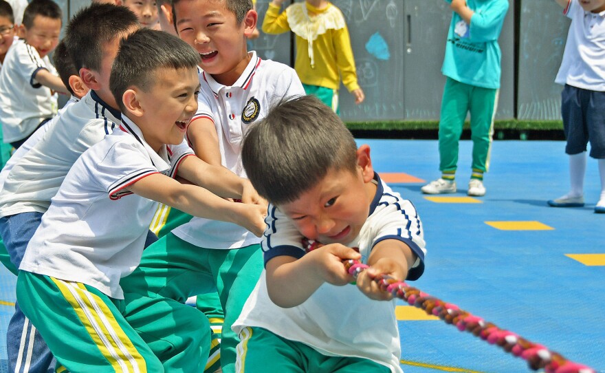 Allowing couples in China to have up to three children rather than two will help the country counteract a population that's shifting towards the elderly, the government says.