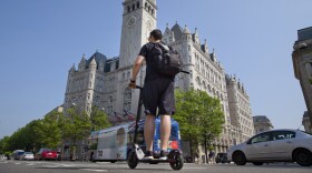 A man rides an electric-scooter-sharing from a company called the 'Bird' along Pennsylvania Ave in downtown Washington D.C., Monday, May 14, 2018.