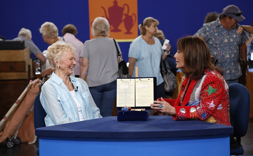 Linda Dyer (right) appraises Charles Loloma gold bracelets, ca. 1981, in Anaheim, Calif.