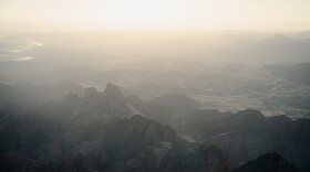 Morning sunlight illuminates the proposed Kw'tsán National Monument during a flyover hosted by the Fort Yuma Quechan Tribe and Ecoflight, a conservation organization, on Oct. 16, 2024. The proposal would grant new federal protections to 390,000 acres of the Quechan Tribe's sacred homelands along the California-Arizona border.