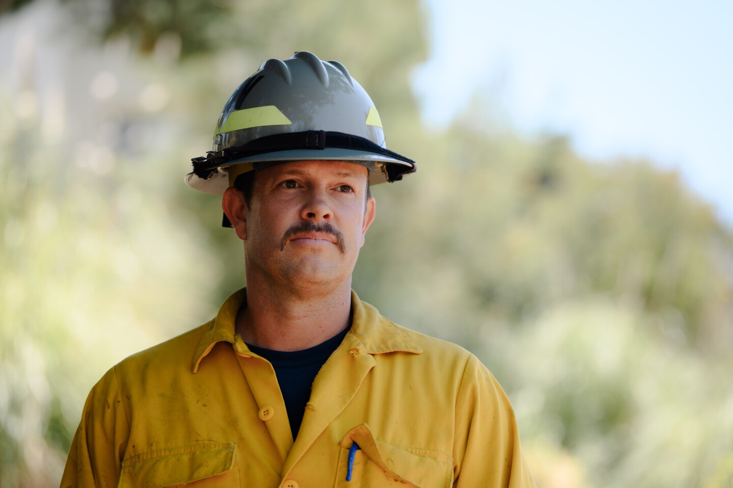 Chula Vista Fire Captain Andy Wilson, who leads the city's new fuels reduction crew, stands for a portrait in the canyon next to Kumeyaay Park in Chula Vista on June 25, 2024. The city's new team of wildlands-trained firefighters launched last year and focuses on clearing out the most dangerous canyons.