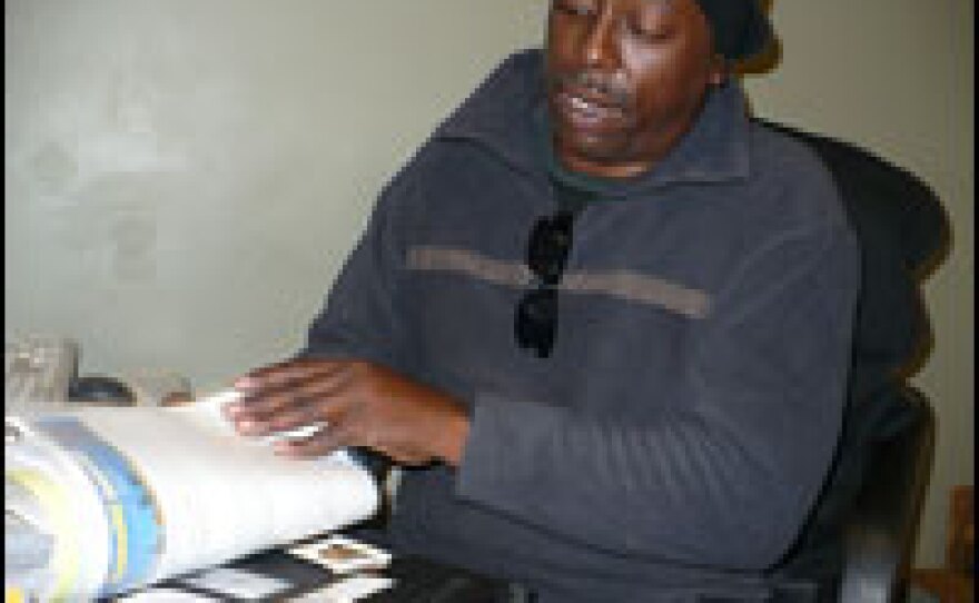 Edward Stewart Jr., 48, looks for a job at an employment center in Kansas City, Mo.