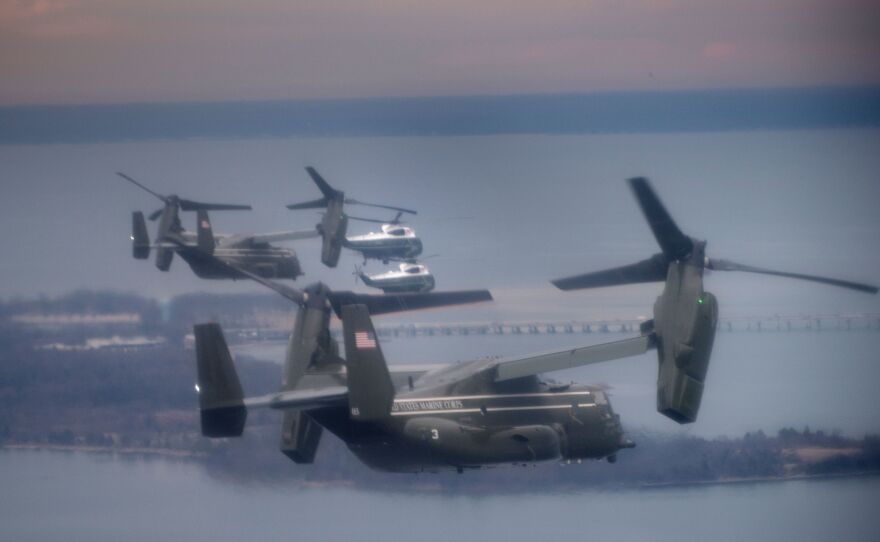 Marine One, with President Trump aboard, flies with a decoy and support helicopters to Dover Air Force Base for the dignified transfer of Navy SEAL Chief Petty Officer William "Ryan" Owens, who was killed in Yemen on Jan. 29. Owens' father says he refused to meet Trump.