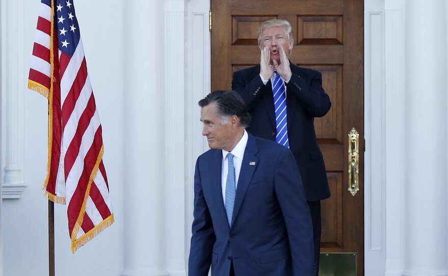 President-elect Donald Trump calls out to the media as Mitt Romney leaves Trump National Golf Club Bedminster in Bedminster, N.J., shortly after Election Day. Romney was under consideration for secretary of state at the time. Now, he's eyeing a Senate race in Utah.