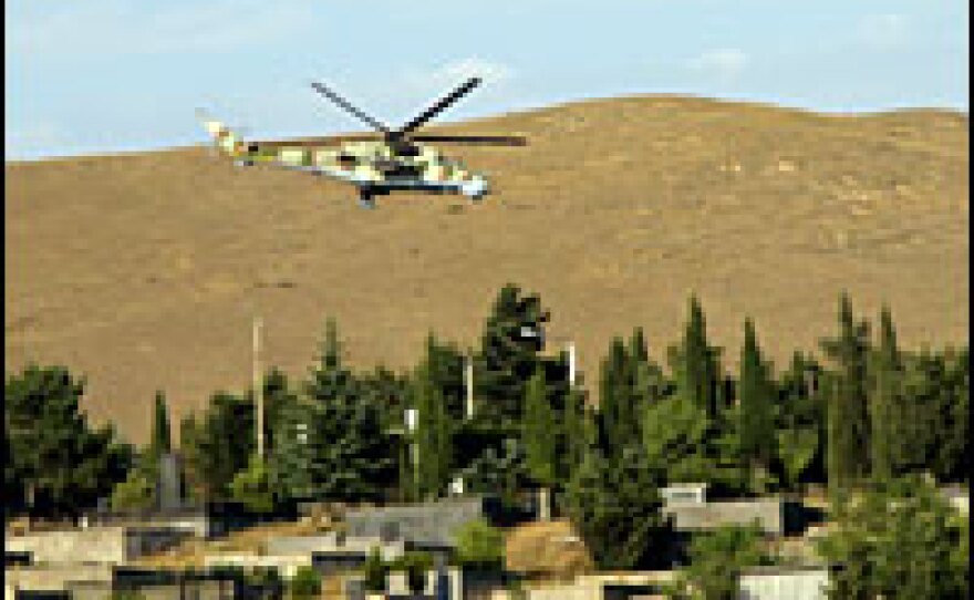 A Russian Hind Mi-24 attack helicopter swoops back after carrying out an airstrike on Aug. 11.