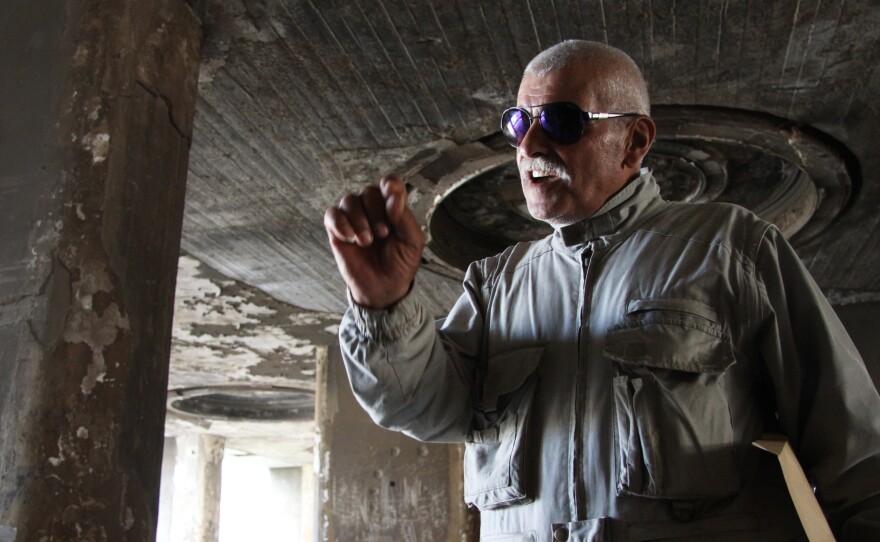 Abu Darwish was a fighter who took part in battles at the Beirut Holiday Inn during the Lebanese civil war in the 1970s and 80s. The building's battered shell remains, but it has not yet been decided whether to tear it down or renovate it.