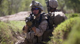 U.S. Marines take cover as they are involved in a gun battle in March during a patrol in Marjah, Afghanistan.  In February, U.S.-led troops set out to rid the area of insurgents and set up a viable local government. But Taliban militants have returned to the area.