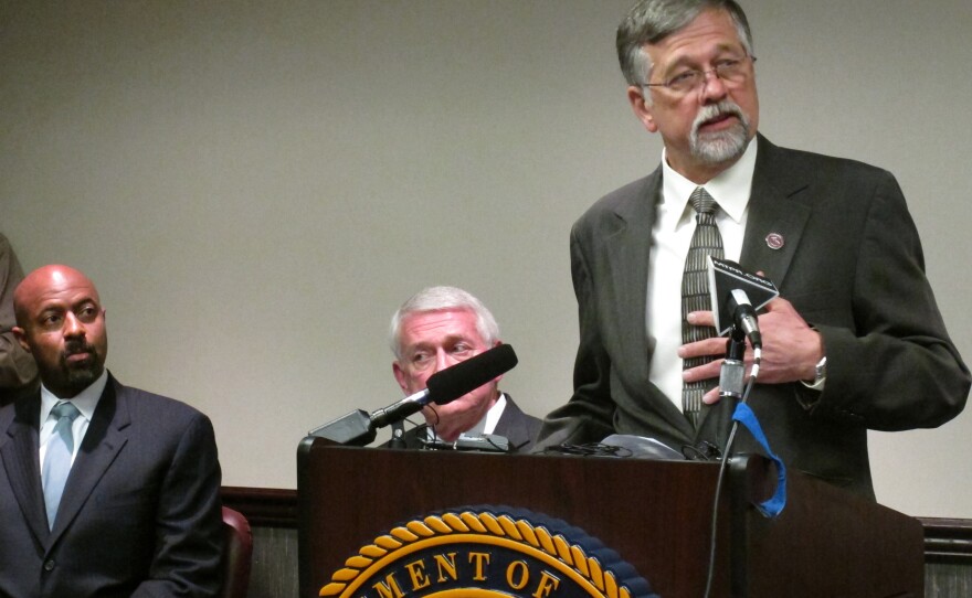University of Montana President Royce Engstrom, right, discusses the school's effort to reform the way it handles sexual assault cases, as Deputy Assistant Attorney General Roy Austin, left, and U.S. Attorney for Montana Michael Cotter listen.