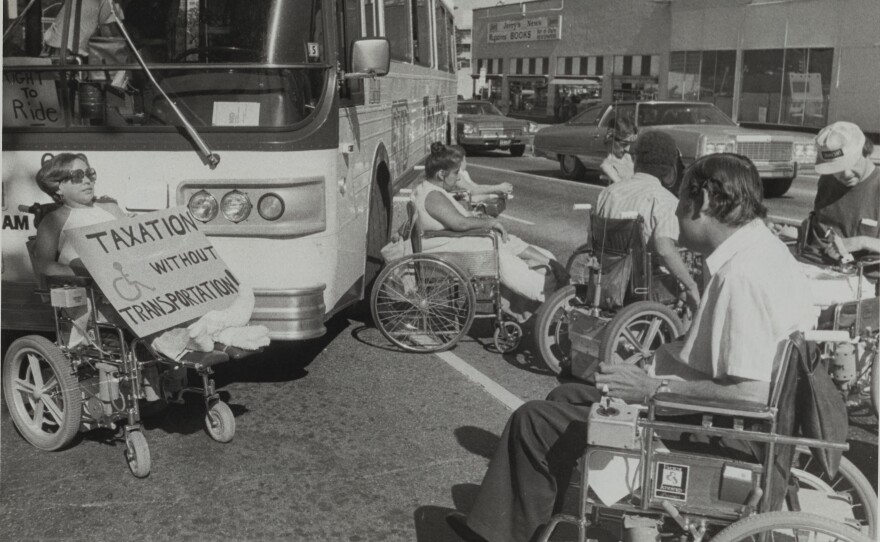 A group of protesters, now known as the Gang of 19, stops traffic in Denver in July 1978.