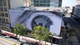 Artist JR's work on the corner of C Street and Fifth Avenue in San Diego. 