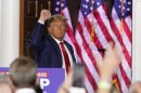 Former President Donald Trump gestures after speaking at Trump National Golf Club in Bedminster, N.J., Tuesday after pleading not guilty in a Miami courtroom earlier in the day to dozens of felony counts that he hoarded classified documents and refused government demands to give them back.