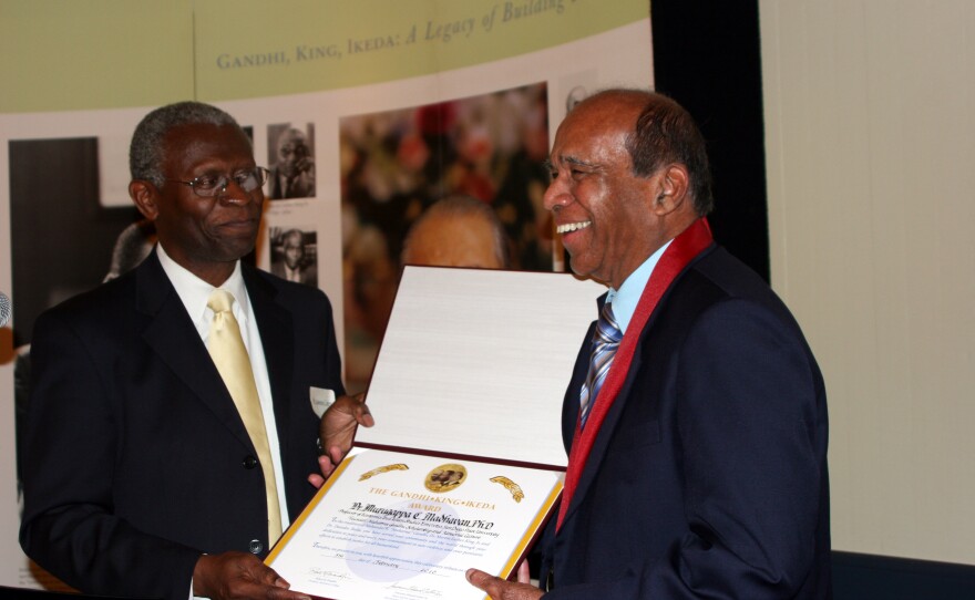 Dr. Lawrence Carter, Dean of M.L.King Jr. International Chapel, Morehouse College in Atlanta, presenting the Gandhi King Ikeda Peace Award to Professor Dr. M.C. Madhavan (Right)