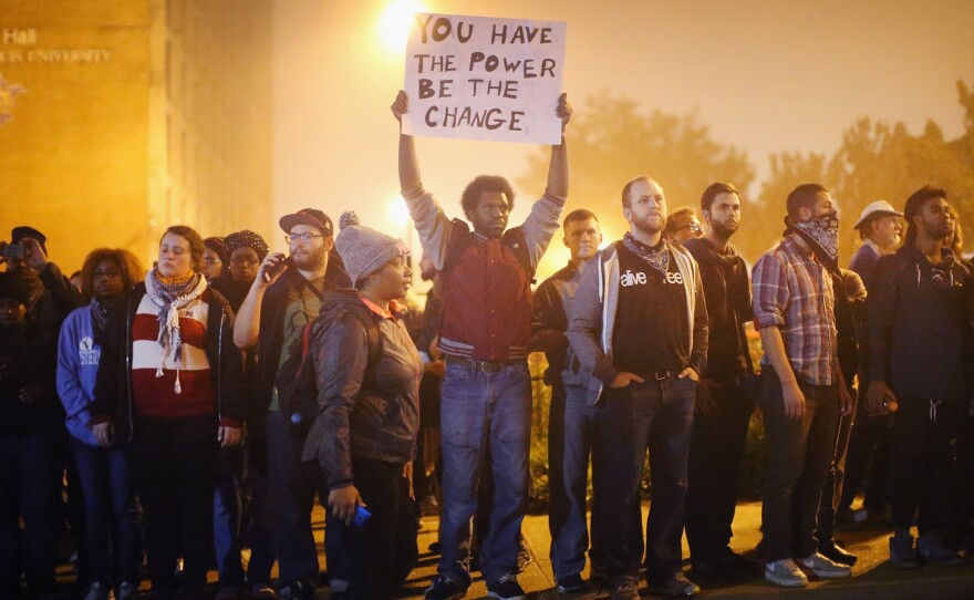 Demonstrators march through the street on Oct. 13, in St Louis, Mo. The St. Louis area has been struggling to heal since riots erupted following the Aug. 9, killing of 18-year-old Michael Brown by a police officer in suburban Ferguson. Another teenager, Vonderrit Myers Jr., was killed by a St. Louis police officer on Oct. 8.