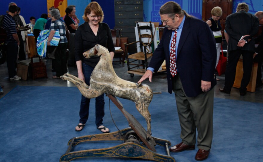 An ANTIQUES ROADSHOW guest and appraiser Noel Barrett discuss a Crandall Hobby Horse, ca. 1880.