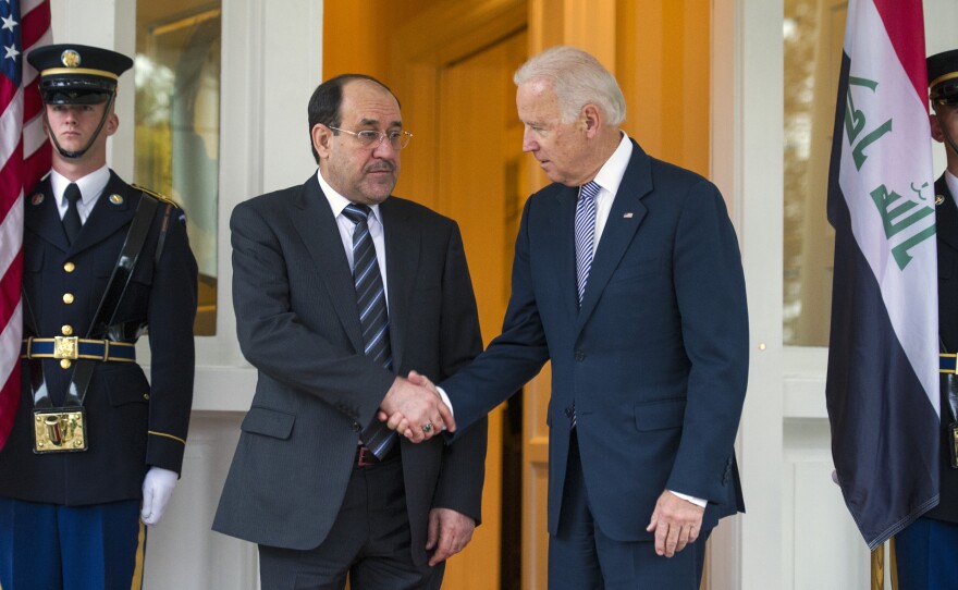 Iraqi Prime Minister Nouri al-Maliki is welcomed by Vice President Biden in Washington on Wednesday. Maliki is asking for U.S. military hardware to fight radical groups behind a recent surge in violence in Iraq.