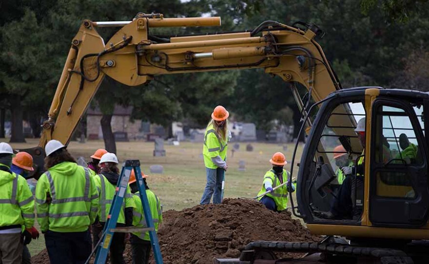 A team of forensic archeologists excavate a suspected mass grave site at Tulsa’s Oaklawn Cemetery. Oct. 19, 2020.