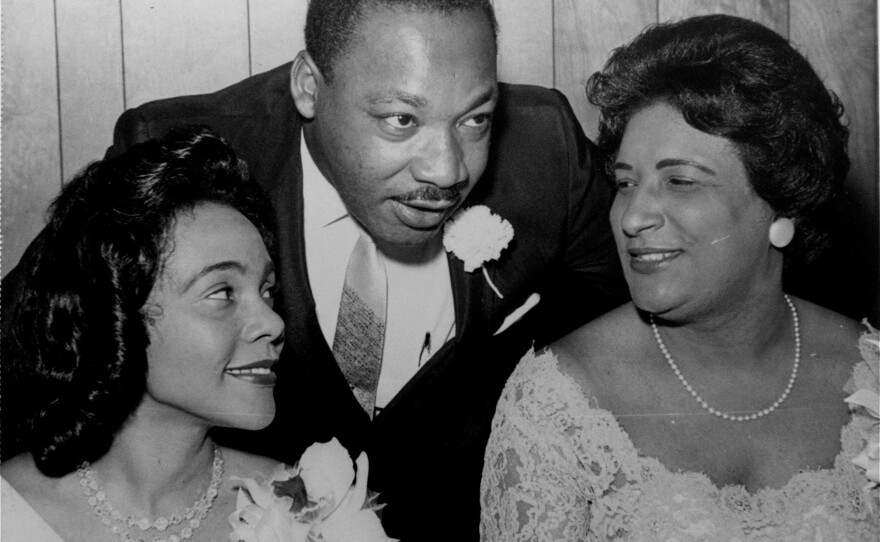 In this Aug. 9, 1965, file photo, Dr. Martin Luther King, Jr. chats with his wife, Coretta, left, and civil rights champion Constance Baker Motley before the start of an S.C.L.C. banquet in Birmingham, Ala.