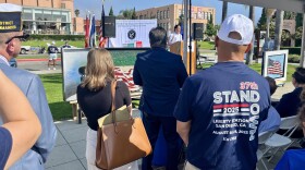 People listen to San Diego Mayor Todd Gloria speak for the opening of Stand Down 2025, Aug. 8, 2025.