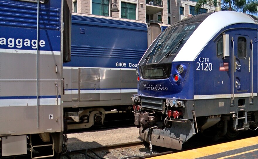Three different Surfliner trains are shown parked at Santa Fe Depot on April 28, 2023.