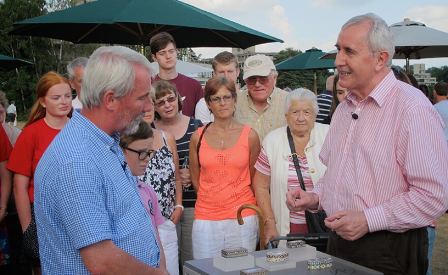 Ian Pickford (right) looks at a collection of Faberge boxes or are they fakes?