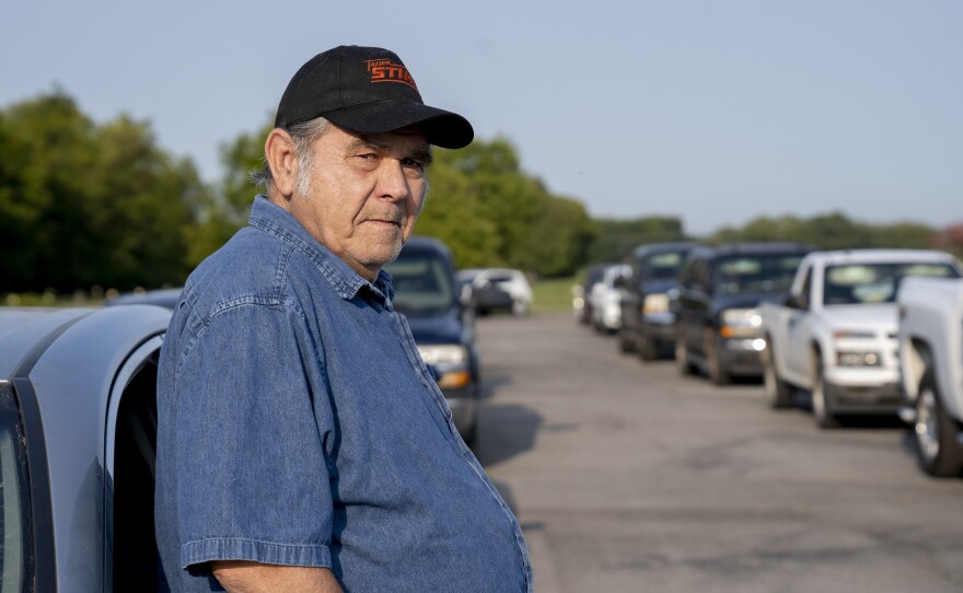 Lloyd Abshier, 70, waits for a drive-through food distribution event to begin in Columbia, Tenn. He arrived over two hours early to get food for his wife and two kids. Despite the hard times, he recently gave $30 to an elderly man in need: "I can't see no one go hungry."
