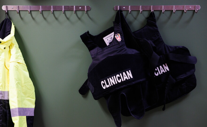 Bulletproof vests for HEART program responders hang inside the office on Sept. 10.