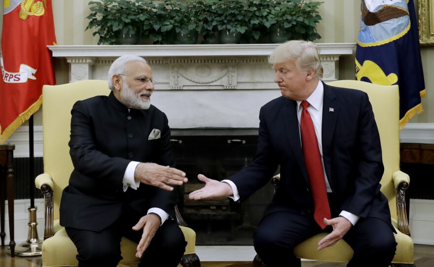 President Donald Trump and Indian Prime Minister Narendra Modi reach to shake hands during their meeting in the Oval Office on Monday. Concerns in New Delhi have centered on whether India will remain a priority relationship for the U.S.