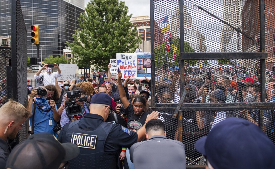 Protesters gathered outside the entrance to a rally for former President Donald Trump on June 20, 2020, in Tulsa, Okla. A new state law increases penalties for protesters who block public roadways, and grants legal immunity to drivers who unintentionally harm them as they try to flee.