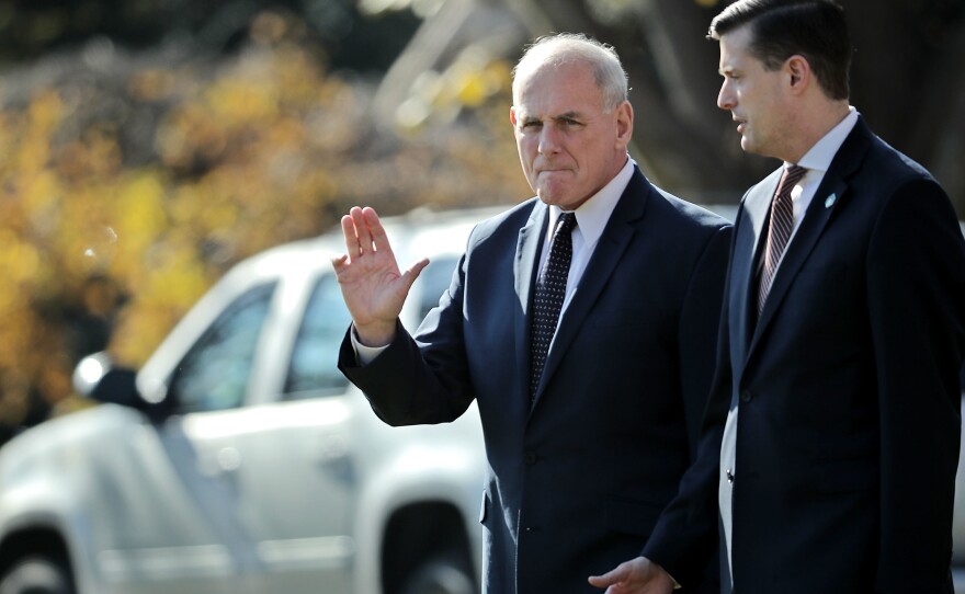 White House chief of staff John Kelly (left) and then-staff secretary Rob Porter leave the White House with President Trump last November. Porter, who had been working for months under an interim security clearance, was forced to resign in February after allegations of domestic abuse became public.