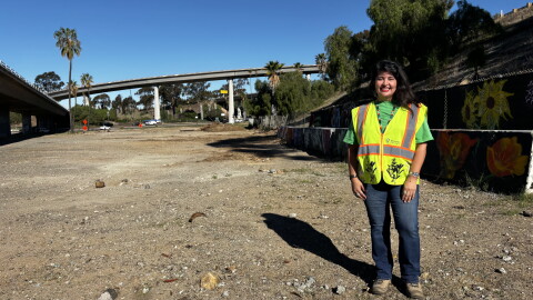 Janice Luna Reynoso, executive director of Mundo Gardens, stands on Caltrans land identified for redevelopment, Oct. 26, 2026.