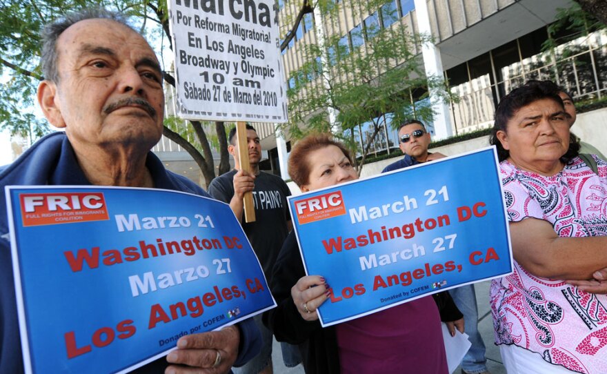 Immigration activists in Los Angeles hold signs promoting Sunday's rally in the nation's capital.
