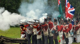 British in firing formation letting loose the “fog of war,” in a re-enactment from "The War of 1812." 