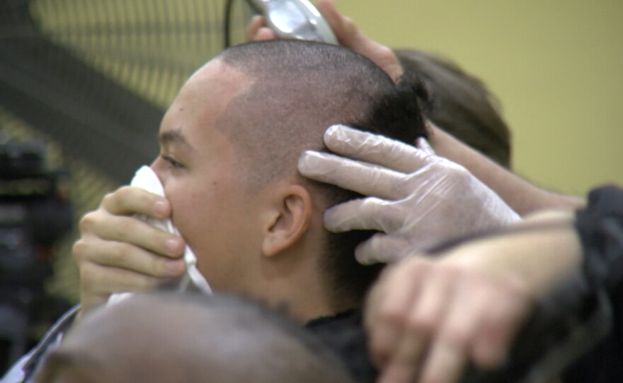 A Marine recruit getting his first haircut during receiving at Marine Corps Recruit Depot, San Diego, Feb. 9, 2021.