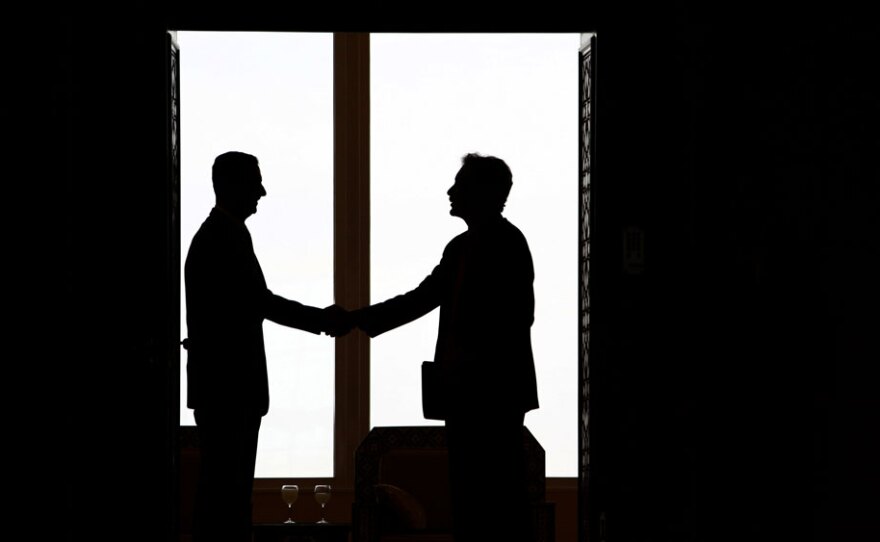 Syrian  President Bashar al-Assad, left,   shakes hands with U.S. undersecretary for  political affairs William Burns, right, ahead of their meeting in Damascus on February 17,  2010.