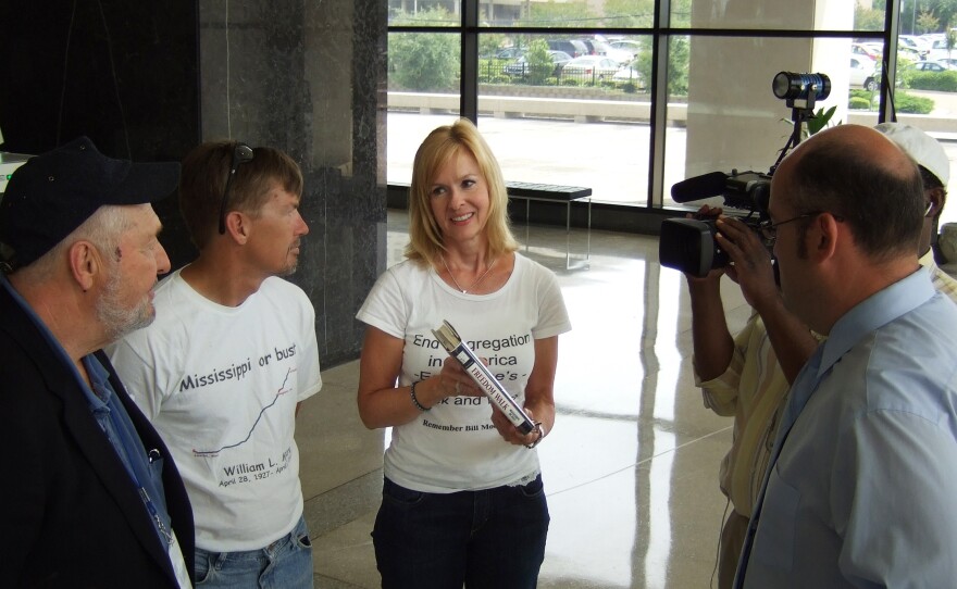 In 2008, Ellen Johnson (center) completed Moore's march, walking from the spot he was killed in Alabama to the Mississippi governor's office in Jackson.