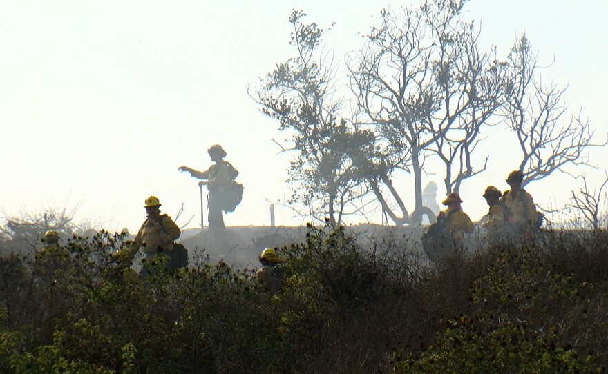 Firefighters fight the Center Fire on Wednesday, Jan. 22, 2025, in Rancho Bernardo.