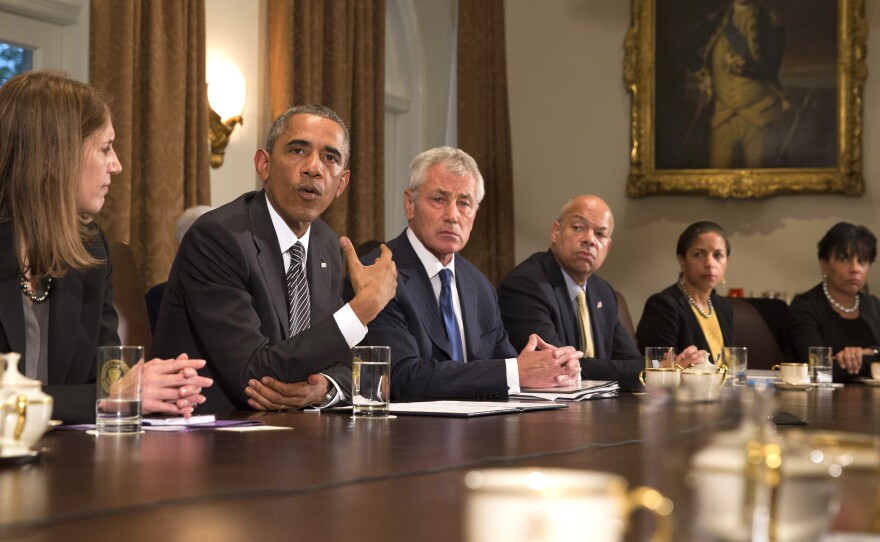 President Barack Obama speaks to the media about Ebola during a meeting in the Cabinet Room of the White House on Wednesday with members of his team coordinating the government's response to the Ebola outbreak.