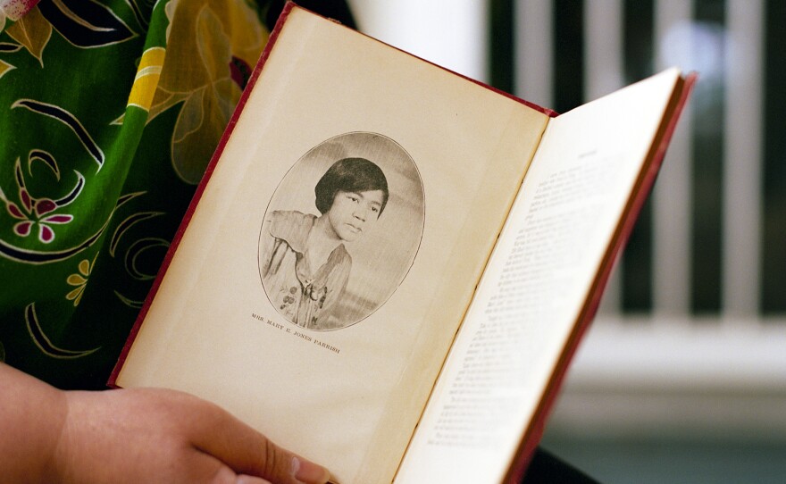 Bruner shows the author photo inside <em>Events of the Tulsa Disaster, </em>her great-grandmother's memoir<em>.</em>