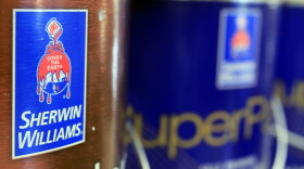 In this Oct. 20, 2010, file photo, cans of paint are seen at a Sherwin Williams store in Brunswick, Maine. 