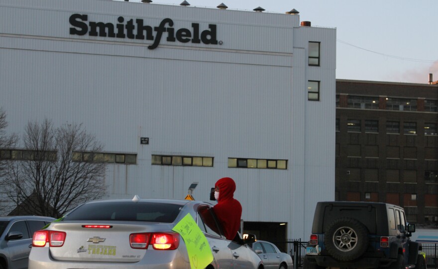 Employees and family members protest outside a Smithfield Foods processing plant in Sioux Falls, South Dakota last week. The plant has had an outbreak of coronavirus cases.